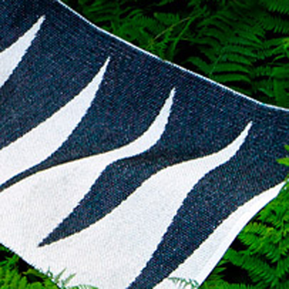 Vivi Black & Vanilla Runner Rug by Pappelina, showing closeup view of vivi black & vanilla runner rug in live shot.