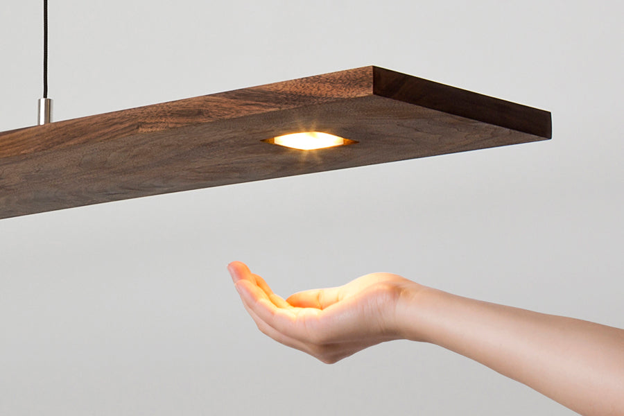 Vix 82" LED Linear Pendant by Cerno, showing closeup view of vix 82" led linear pendant in live shot.