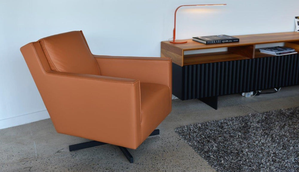 Washington Swivel Arm Chair by SohoConcept, showing angle view of swivel arm chair in live shot.