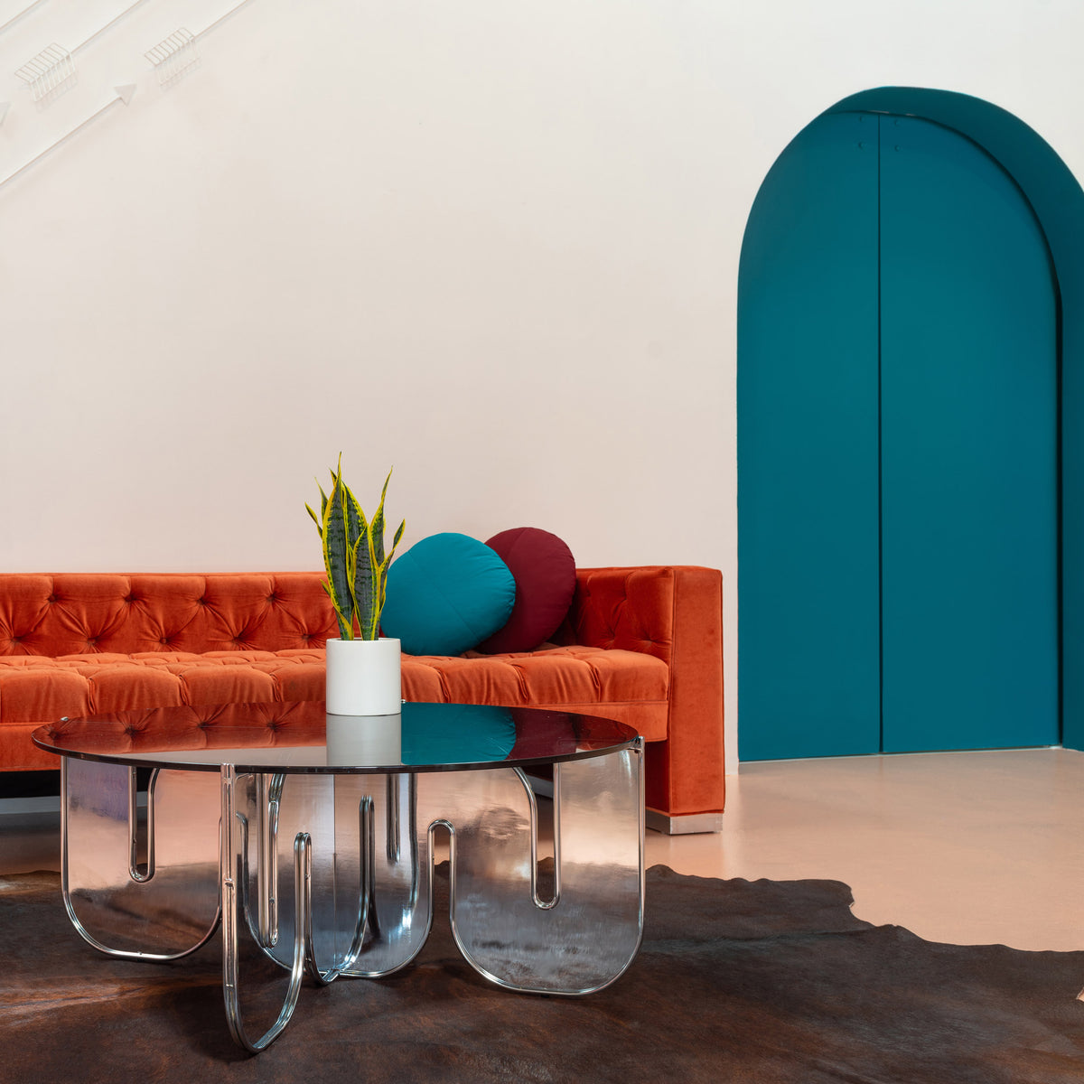 Wave Table by Bend, showing wave table with sofa in live shot.