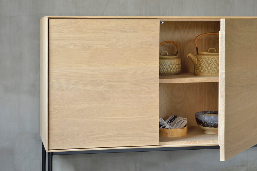 Whitebird Sideboard by Ethnicraft, showing closeup view of whitebird oak sideboard in live shot.