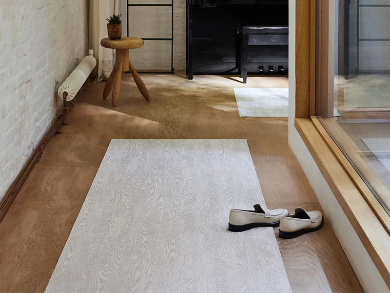 Woodgrain Woven Floor Mat by Chilewich, showing woodgrain woven floor mat in live shot.
