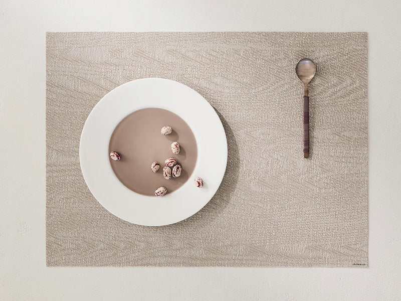 Woodgrain Placemat by Chilewich, showing woodgrain placemat in live shot.
