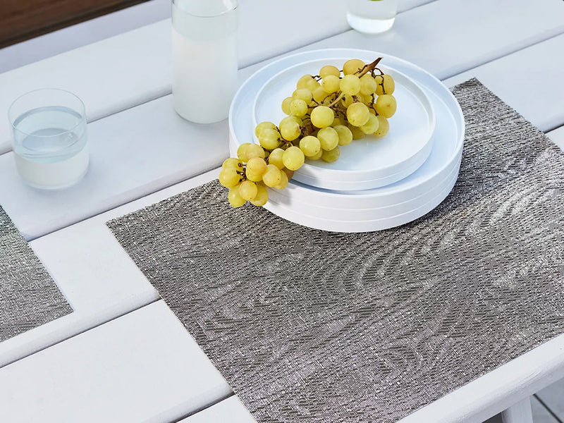Woodgrain Placemat by Chilewich, showing woodgrain placemat in live shot.