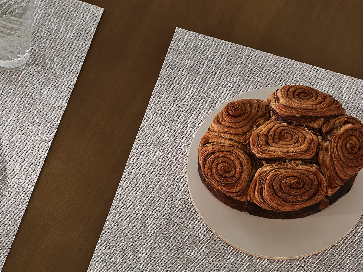Woodgrain Placemat by Chilewich, showing woodgrain placemat in live shot.