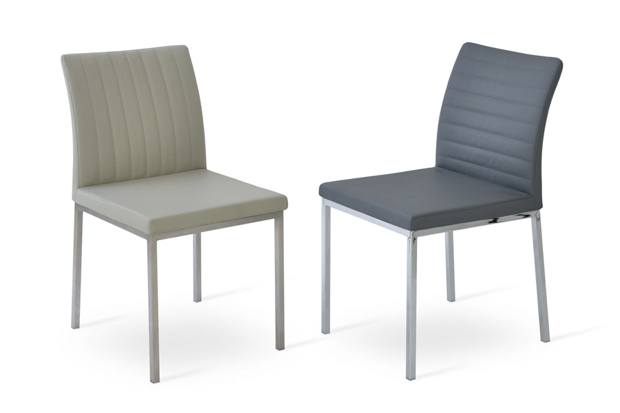 Zeyno Metal Dining Chair by SohoConcept, showing two chairs in grey & light grey leatherette with stainless steel base.
