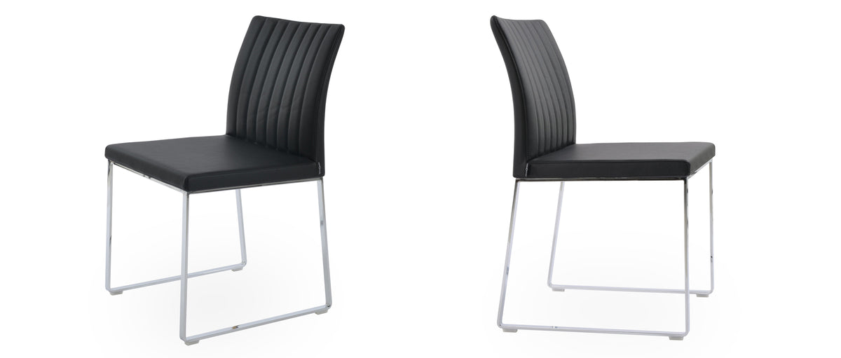 Zeyno Sled Chair by sohoConcept, showing two sled chairs in black leatherette.
